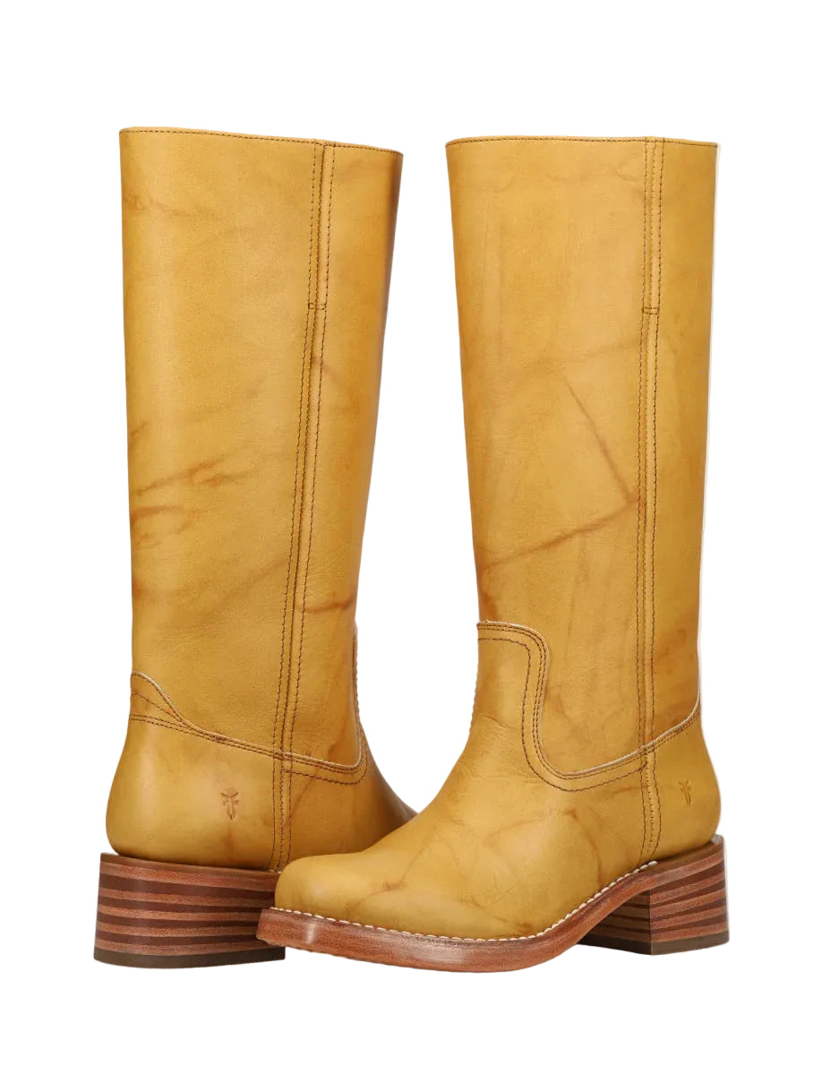 Pair of yellow knee-high boots on a white background