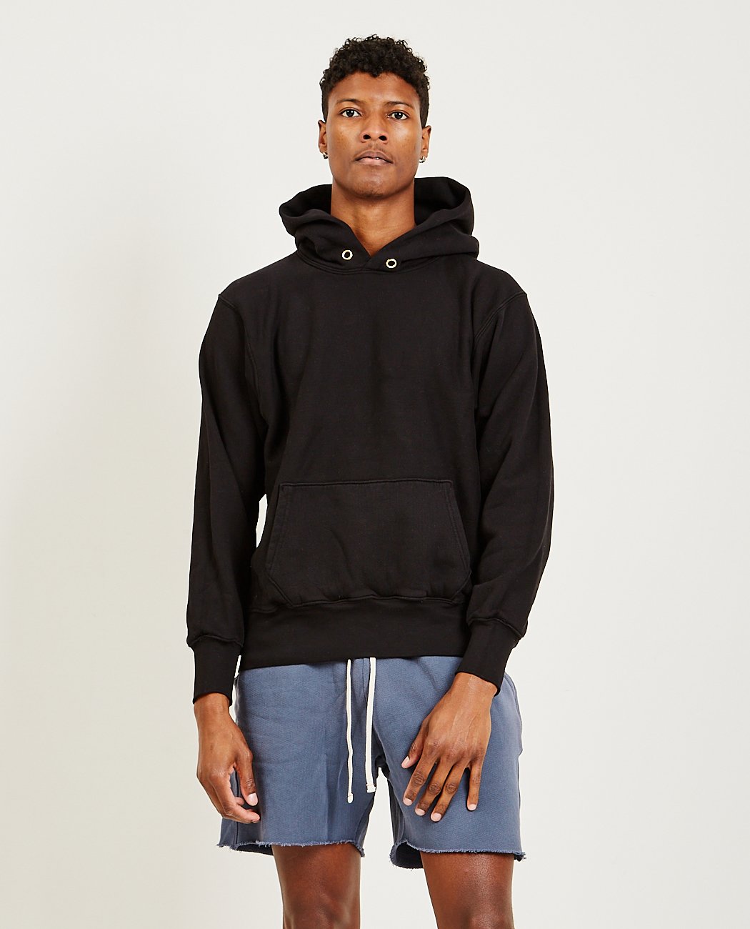 Men's black cropped hoodie with kangaroo pocket, front view